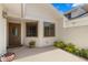 Welcoming front entryway with a stylish door, decorative plants, and neutral color scheme at 440 Lakeview Dr # 34, Palm Harbor, FL 34683