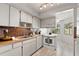 Well-maintained kitchen boasts sleek appliances, butcher block countertops, and an open floor plan at 440 Lakeview Dr # 34, Palm Harbor, FL 34683
