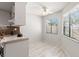 Bright kitchen area with white cabinets, wood counters and room for a breakfast nook at 440 Lakeview Dr # 34, Palm Harbor, FL 34683