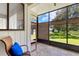 Screened patio with views of landscaped grounds, provides a relaxing outdoor space at 440 Lakeview Dr # 34, Palm Harbor, FL 34683