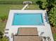 Aerial view of the community pool and lounge area, perfect for relaxing in the sun at 440 Lakeview Dr # 34, Palm Harbor, FL 34683