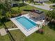Aerial view of community pool, including a covered patio area perfect for shade and relaxation at 440 Lakeview Dr # 34, Palm Harbor, FL 34683