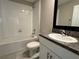 Bathroom with white cabinets, granite counters, a bathtub-shower combo, and tile flooring at 4448 Globe Thistle, Tampa, FL 33619