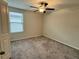Bedroom with neutral carpet, a ceiling fan, and a window with blinds at 4448 Globe Thistle, Tampa, FL 33619
