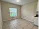 Bright dining area featuring tile flooring and a window with backyard views and overhead recessed lighting at 4448 Globe Thistle, Tampa, FL 33619
