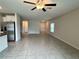 Spacious living room featuring tile flooring, neutral walls, and an open layout at 4448 Globe Thistle, Tampa, FL 33619