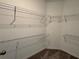 Spacious walk-in closet with wire shelving and carpeted floor at 4448 Globe Thistle, Tampa, FL 33619