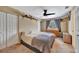 Comfortable bedroom with a ceiling fan, closet, TV, and large window at 4612 E Seneca Ave, Tampa, FL 33617