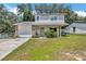 Charming two-story home featuring stone accents, a well-maintained yard, and inviting curb appeal at 4612 E Seneca Ave, Tampa, FL 33617
