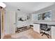 Bright home office features a view out a window, shelving, and a functional work area at 4612 E Seneca Ave, Tampa, FL 33617