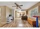 Open kitchen and dining area with wood-style flooring, vintage cabinets, and natural light at 4612 E Seneca Ave, Tampa, FL 33617