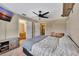 Spacious main bedroom features an ensuite bathroom, ceiling fan, and side tables at 4612 E Seneca Ave, Tampa, FL 33617