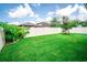 Spacious backyard featuring well-manicured lawn and a white fence providing privacy and a sense of seclusion at 5003 Wabash Pl, Riverview, FL 33578