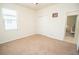 Bedroom showing carpet, closet, and view into hallway at 5003 Wabash Pl, Riverview, FL 33578