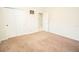 Well-lit bedroom with a large closet, carpeted floors, and neutral walls at 5003 Wabash Pl, Riverview, FL 33578