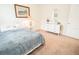 Bedroom features carpet, white dresser and trim, and bright light from a window at 5003 Wabash Pl, Riverview, FL 33578