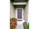 Charming entryway with a neatly kept walkway leading to the front door, surrounded by flowers at 5003 Wabash Pl, Riverview, FL 33578