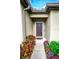 Welcoming front entrance with colorful flowers and plants lining the walkway to the front door at 5003 Wabash Pl, Riverview, FL 33578
