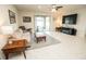 A well-lit living room features tile flooring, a patio view, and recessed lighting throughout at 5003 Wabash Pl, Riverview, FL 33578