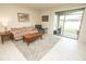 Comfortable living room features tile flooring, recessed lighting and sliding glass door access to outdoor patio at 5003 Wabash Pl, Riverview, FL 33578