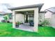 Cozy covered patio featuring a ceiling fan, brick pavers, and sliding glass doors to seamlessly blend indoor and outdoor living at 5003 Wabash Pl, Riverview, FL 33578
