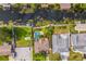 Aerial view of the property showcasing the pool, backyard, boat dock, and waterfront location at 51 Cypress Dr, Palm Harbor, FL 34684