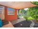 Cozy backyard with a shade cover near canal; ideal for outdoor entertaining and serene relaxation at 51 Cypress Dr, Palm Harbor, FL 34684