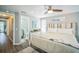 Comfortable bedroom with ensuite bathroom, wooden accent headboard and neutral tones at 51 Cypress Dr, Palm Harbor, FL 34684