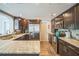 Well-equipped kitchen with stainless steel appliances, granite counters, and dark wood cabinets at 51 Cypress Dr, Palm Harbor, FL 34684