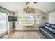 Bright living room with a vaulted ceiling, waterfront views, and stylish nautical decorations at 51 Cypress Dr, Palm Harbor, FL 34684