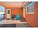 Outdoor patio area with grill, chairs, and shade cover; perfect for barbecues and backyard relaxation at 51 Cypress Dr, Palm Harbor, FL 34684