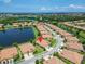Aerial view showcasing the home's location within a community with scenic lakes and waterways at 5422 Sunset Falls Dr, Apollo Beach, FL 33572