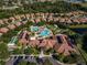 Aerial view of community clubhouse with large pool, cabanas, ample parking, and other outdoor activities at 5422 Sunset Falls Dr, Apollo Beach, FL 33572