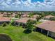 This single Gathering home has a screen enclosed lanai and is surrounded by lush green grass at 5422 Sunset Falls Dr, Apollo Beach, FL 33572