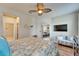 Bedroom view showcasing seamless flow to living spaces and comfortable seating at 5422 Sunset Falls Dr, Apollo Beach, FL 33572