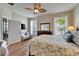 Bright bedroom with water view, ceiling fan, and coastal-themed decor for relaxed living at 5422 Sunset Falls Dr, Apollo Beach, FL 33572