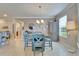 Inviting dining area boasts natural light, a stylish table set, and a beverage bar, perfect for entertaining at 5422 Sunset Falls Dr, Apollo Beach, FL 33572