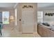 Entryway view with decorated front door and sidelight windows at 5422 Sunset Falls Dr, Apollo Beach, FL 33572