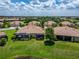 Expansive lawn with screened lanais on the rear of these well maintained detached homes at 5422 Sunset Falls Dr, Apollo Beach, FL 33572