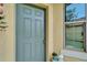 Charming front entrance featuring a stylish blue door and decorative accents at 5422 Sunset Falls Dr, Apollo Beach, FL 33572