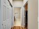 Hallway leading to bathroom and closet, offering ample storage solutions at 5422 Sunset Falls Dr, Apollo Beach, FL 33572