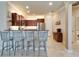 Gourmet kitchen featuring granite countertops, a breakfast bar with seating, and stainless steel appliances at 5422 Sunset Falls Dr, Apollo Beach, FL 33572