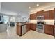 Updated kitchen offers modern appliances, granite countertops, and a seamless transition to the dining area at 5422 Sunset Falls Dr, Apollo Beach, FL 33572
