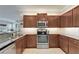 Elegant kitchen featuring granite countertops, stainless steel appliances, and ample cabinet space, ideal for cooking at 5422 Sunset Falls Dr, Apollo Beach, FL 33572