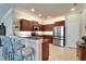 Modern kitchen includes stainless steel appliances, a breakfast bar, and ample cabinet space for a functional design at 5422 Sunset Falls Dr, Apollo Beach, FL 33572