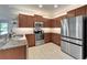 Well-equipped kitchen with stainless steel appliances, granite countertops, and backsplash, offering both style and convenience at 5422 Sunset Falls Dr, Apollo Beach, FL 33572