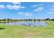 Community lake view reflecting the landscape of the surrounding neighborhood at 5422 Sunset Falls Dr, Apollo Beach, FL 33572