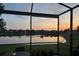 Water view from screened in lanai during sunset at 5422 Sunset Falls Dr, Apollo Beach, FL 33572
