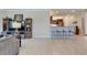 Open living space featuring tile floors and breakfast bar at 5422 Sunset Falls Dr, Apollo Beach, FL 33572