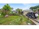 Charming single-story home with a lush green lawn and mature landscaping, offering great curb appeal at 5643 86Th N Ave, Pinellas Park, FL 33782